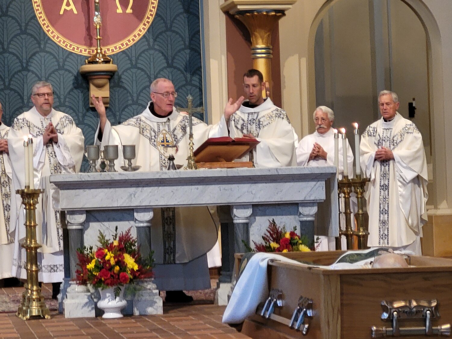 Benedictine Abbot Benedict Neenan of Conception Abbey and concelebrating priests pray the Eucharistic Prayer at the Funeral Mass for Father Clarence Wiederholt, a retired priest of the Jefferson City diocese, on Nov. 3 in the Basilica of the Immaculate Conception at the abbey.